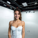 Cheerful Young Woman in White Dress in Studio Setting