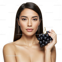 Elegant Woman with Black Grapes Beautiful Skin and Natural Makeup