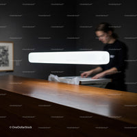 Modern interior with sleek wooden counter and soft lighting