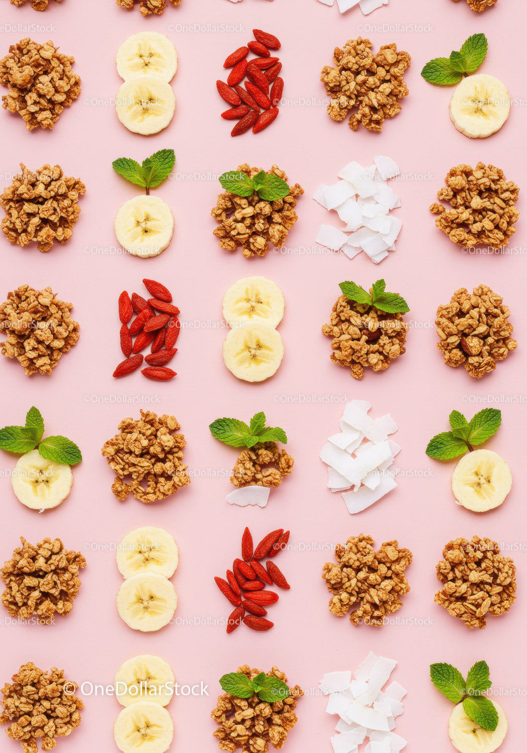 Healthy breakfast ingredients arranged on pink background