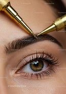 Close-Up of Eyebrow Microblading Procedure with Gold Needles
