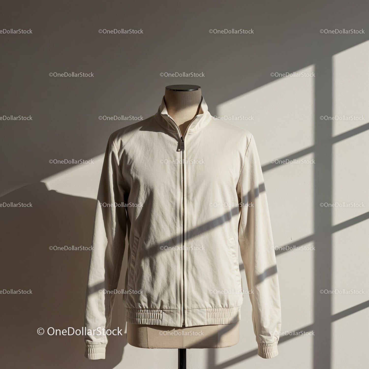 Minimalist light beige jacket displayed on mannequin