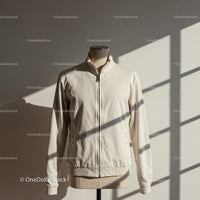 Minimalist light beige jacket displayed on mannequin