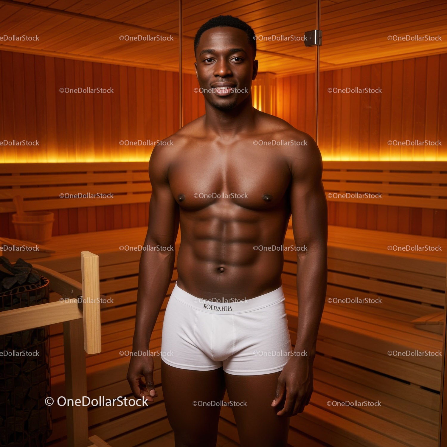 Male Fitness Model In Sauna Room With Wooden Walls And Warm Lighting