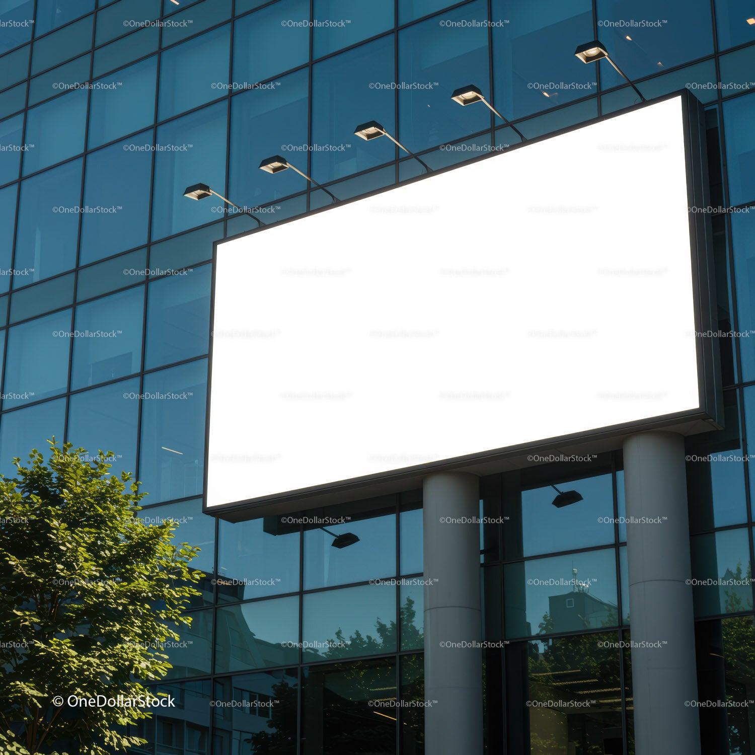 Blank illuminated billboard on modern glass building facade