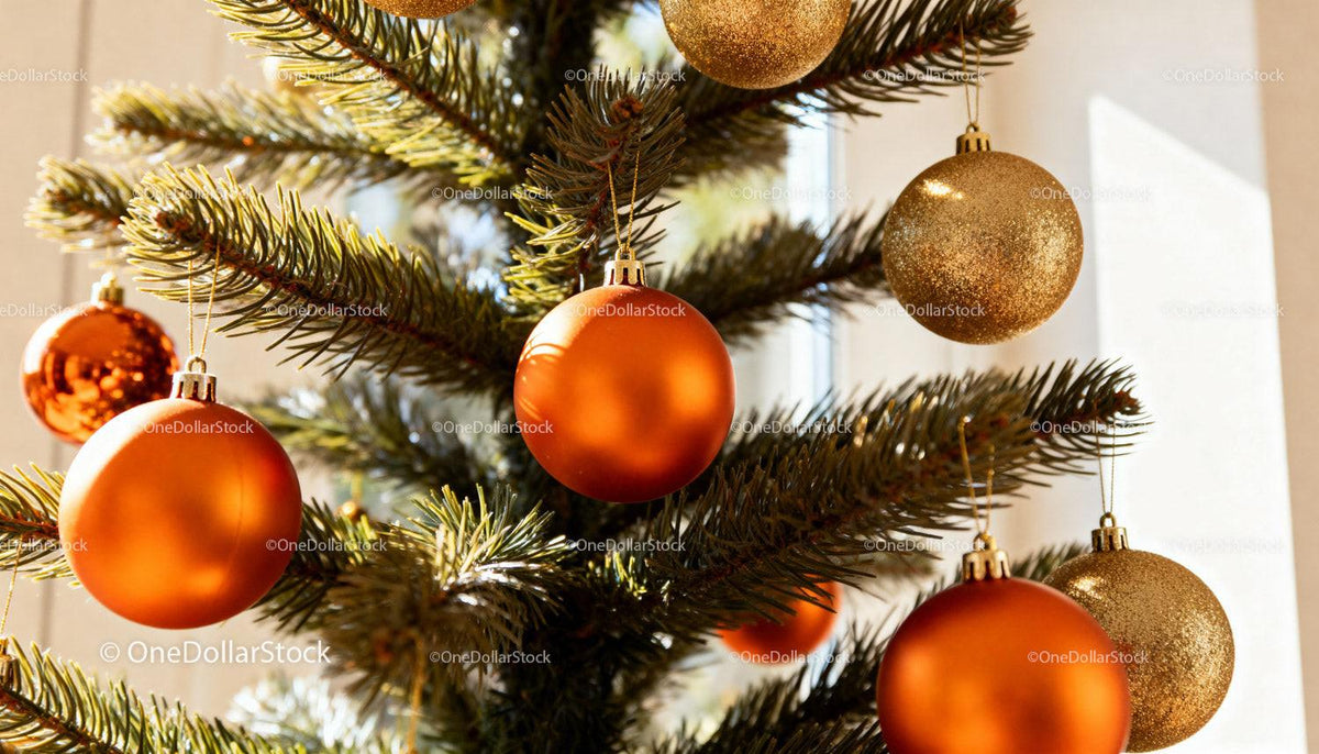 Decorated Christmas tree with orange and gold baubles