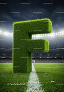 Large Grass Letter F on Football Field at Night