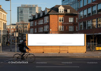 Cyclist passing blank billboard in urban city street JPG Mockup Image preview