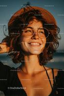 Joyful Woman with Sunglasses and Straw Hat in Bright Summer Scene