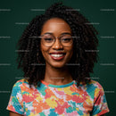 Vibrant Smiling Woman with Curly Hair Wearing Glasses and Colorful T-Shirt