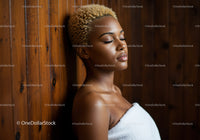 Serene Woman with Perfect Skin Resting Against Wooden Wall