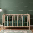 Modern Wooden Baby Crib with Green Bedding in Nursery