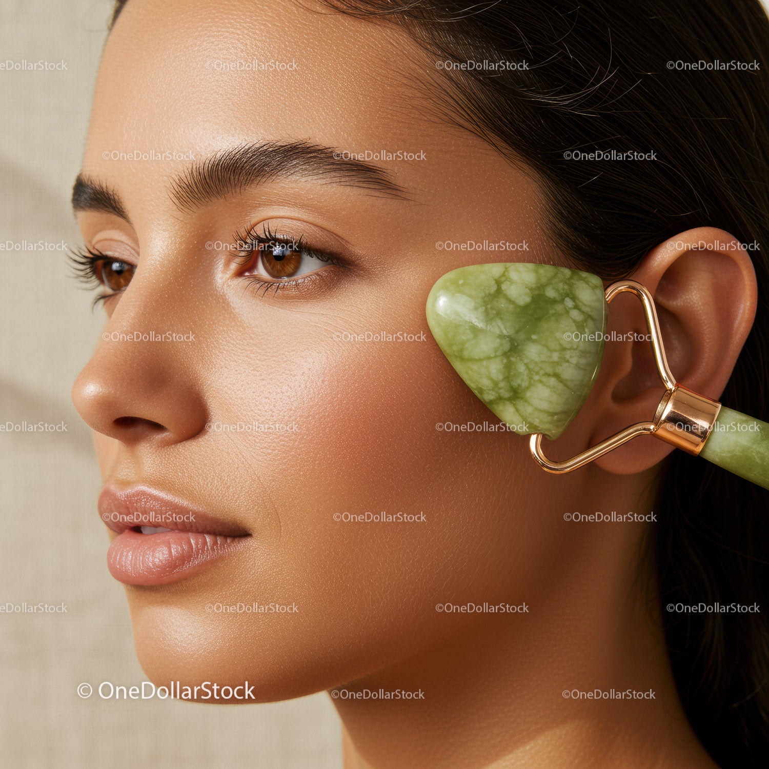 Close-Up of Woman Using Jade Roller on Face for Skin Rejuvenation