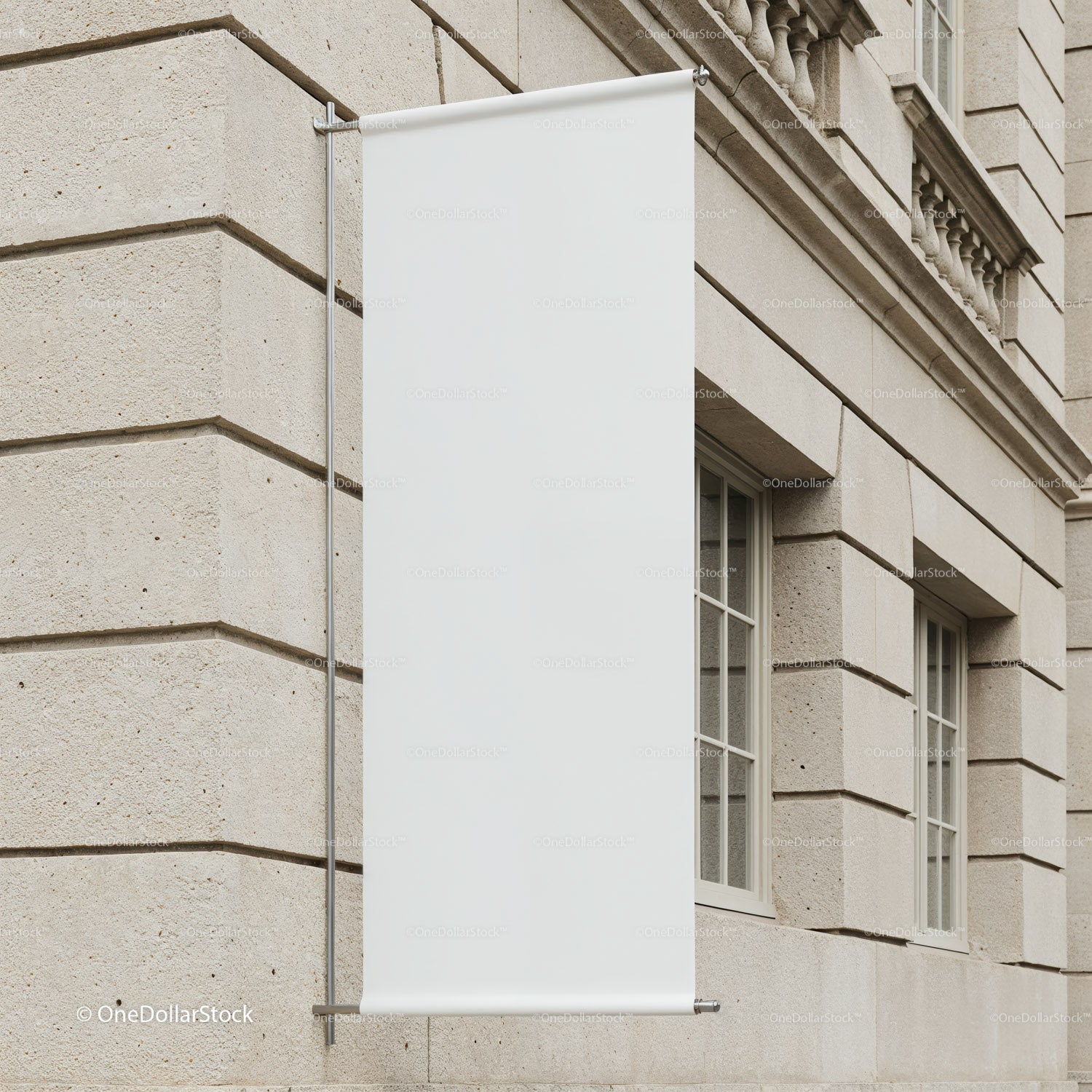 Blank vertical banner hanging on stone building facade