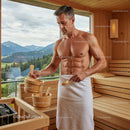 Healthy Man Relaxing in Sauna with Scenic Mountain View