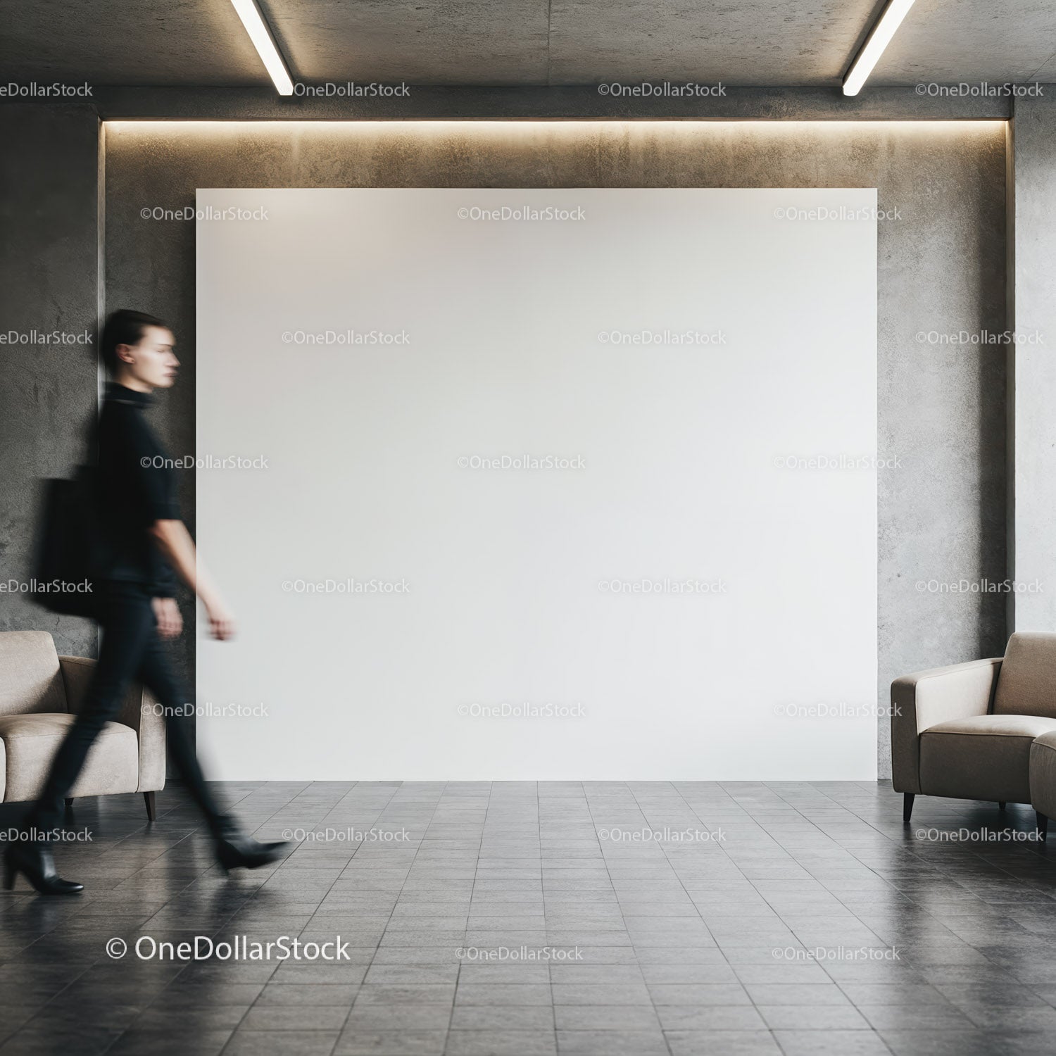 Blurred woman walking past blank wall in modern lobby