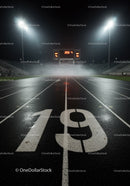 Night view of illuminated wet running track lane nineteen