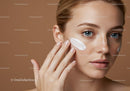 Young Woman Applying Facial Cream for Skin Rejuvenation