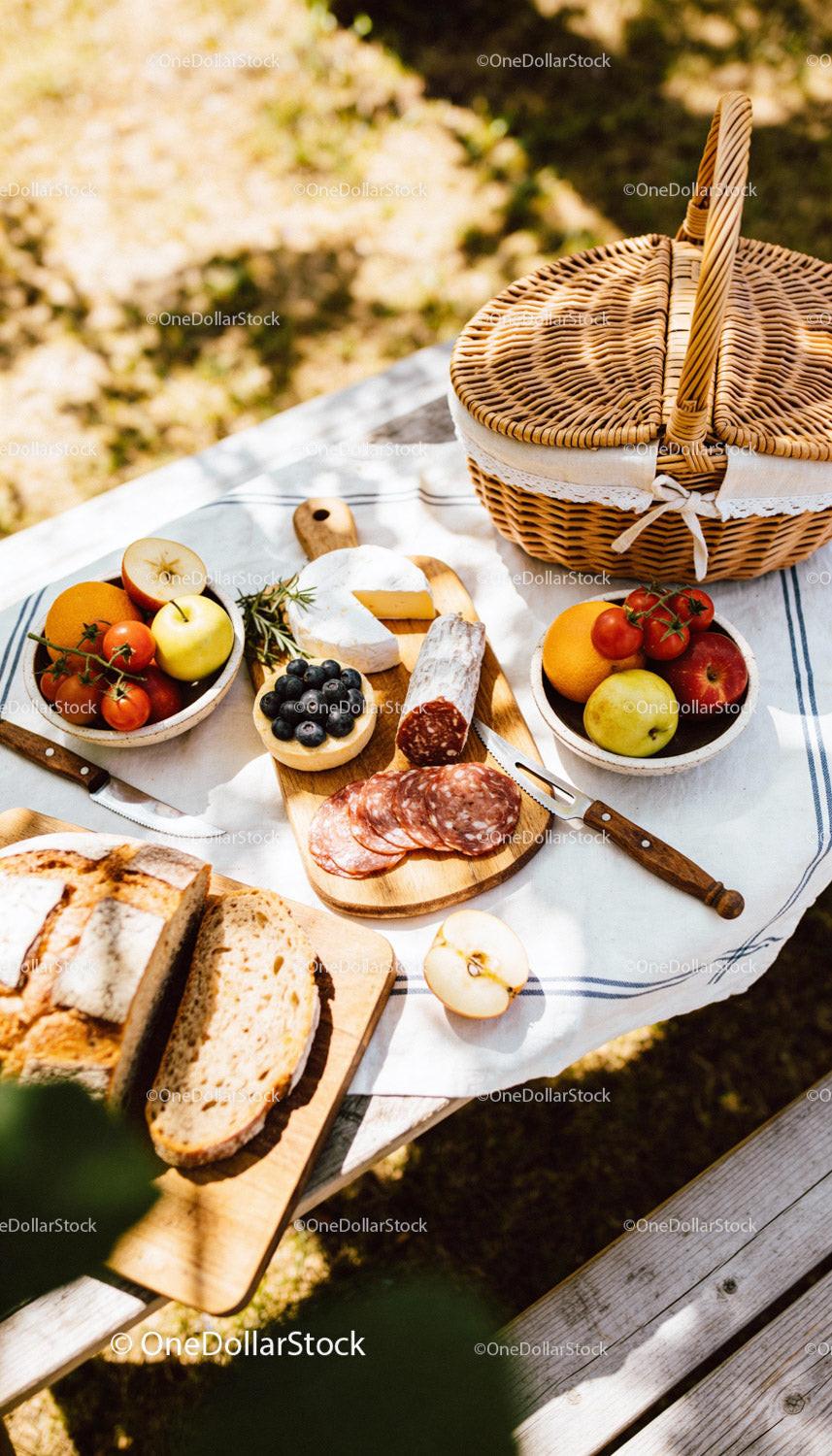 Rustic Picnic Setup with Fresh Fruits and Artisan Bread
