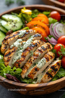 Grilled Chicken Breast with Fresh Salad and Herb Sauce in Wooden Bowl