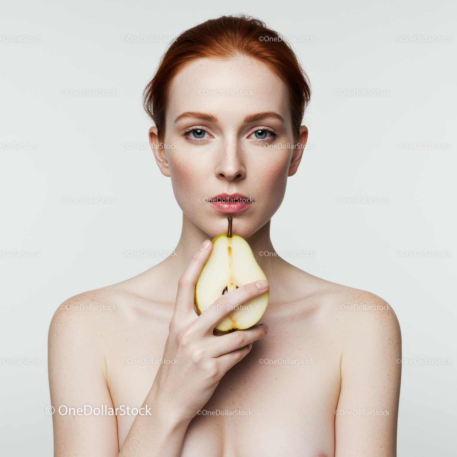 Elegant Woman Holding Fresh Pear in Minimalist Studio Portrait