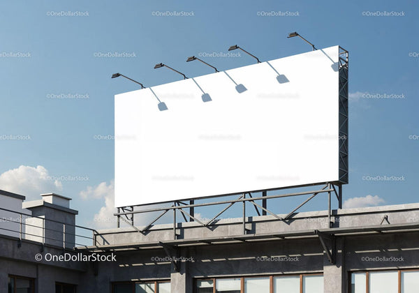 Large blank billboard on rooftop under clear sky JPG Mockup Image