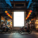 Evening street scene with motorbikes and lanterns