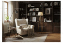 Cozy reading nook with armchair and wooden bookshelves