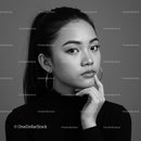 Elegant Black and White Portrait of a Confident Woman with Hoop Earrings