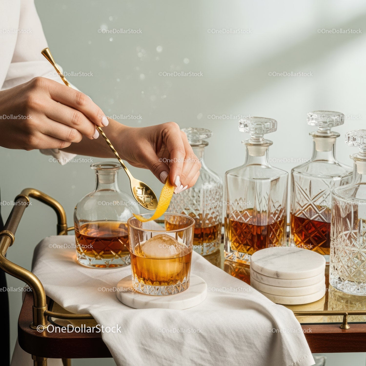 Elegant Whiskey Bottle Display with Crystal Decanters and Stylish Glassware