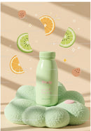 Minimalist green bottle on plush cushion with citrus art
