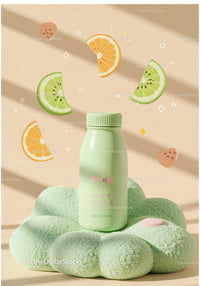 Minimalist green bottle on plush cushion with citrus art