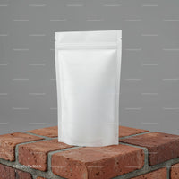 Blank White Stand-Up Pouch on Rustic Brick Surface