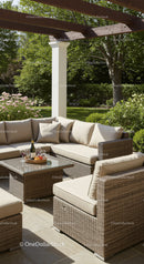 Elegant Outdoor Patio with Wicker Lounge Furniture and Lush Garden Setup