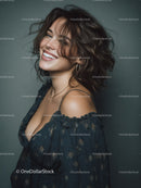 Happy Young Woman with Wavy Hair and Earrings in Studio Light