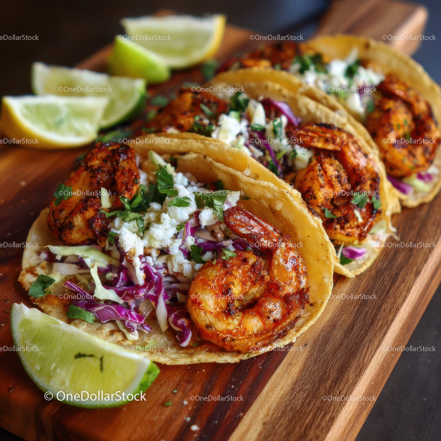 Seafood Shrimp Tacos with Fresh Vegetables and Lime Wedges