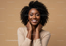 Elegant Black Woman with Curly Hair Smiling Portrait in Studio