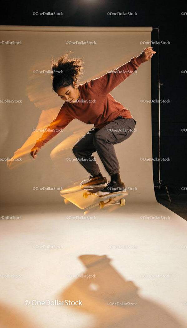 Young Skater Performing Trick Indoors with Motion Blur