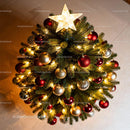 Top view of decorated Christmas tree with glowing star