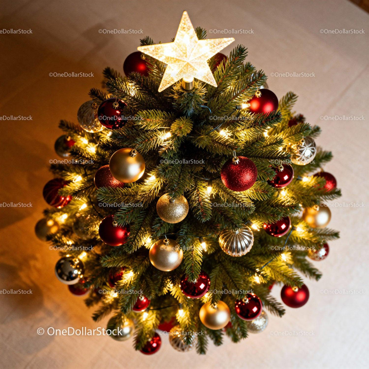 Top view of decorated Christmas tree with glowing star