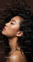 Profile of serene woman with flowing curly hair