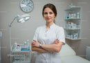 Female Nurse Standing with Crossed Arms in Modern Healthcare Clinic