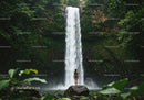 Woman Standing in Front of Tropical Waterfall Amidst Green Jungle