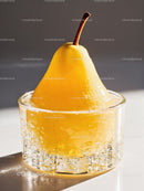 Fresh Yellow Pear in Clear Glass with Sparkling Water