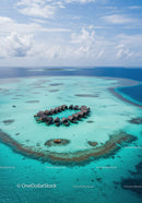 Overwater Bungalows on Turquoise Lagoon Surrounded by Coral Reef