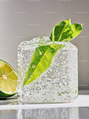 Fresh Green Leaves Frozen Inside Transparent Ice Cube