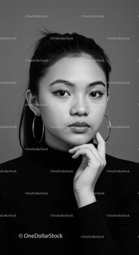 Elegant Black and White Studio Portrait of Young Asian Woman