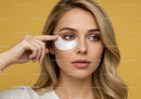 Young Woman Applying Facial Under-Eye Mask with Fresh Skin