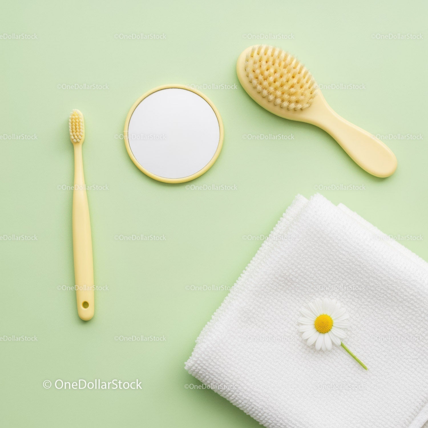 Yellow Bathroom Accessories with White Towel and Daisy