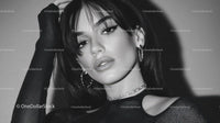 Elegant Woman in Stylish Dark Attire Showcasing Modern Glamour